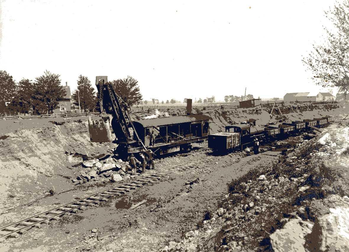 Historic photograph of a steam shovel and railway equipment in the Russell quarry.