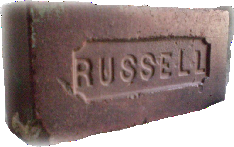 A brick stamped with the name Russell.
