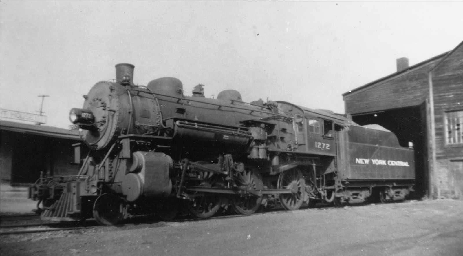 A New York Central steam locomotive beside the Russell brick plant.
