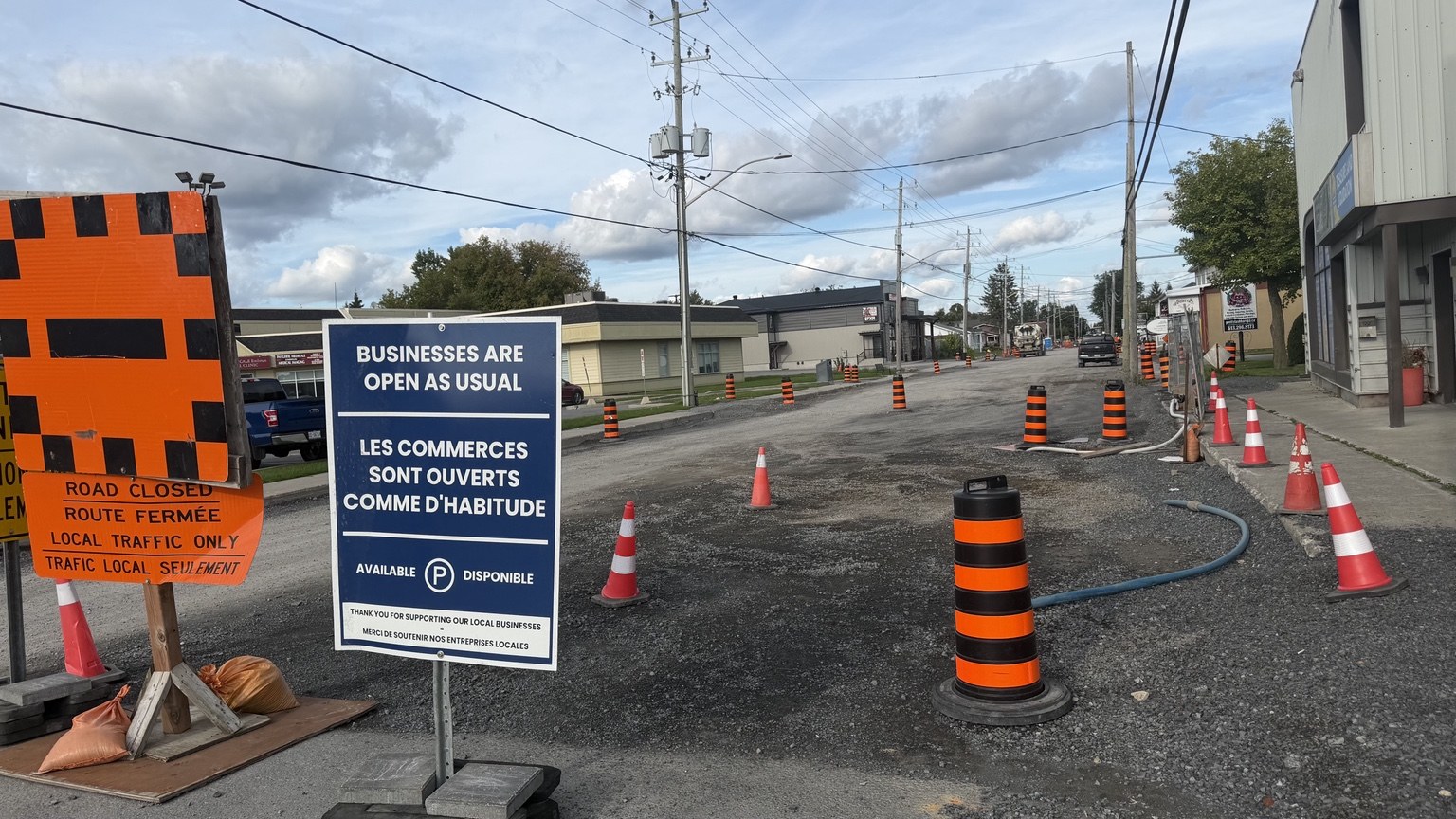 Businesses-open signs beside construction on Notre-Dame Street in Embrun